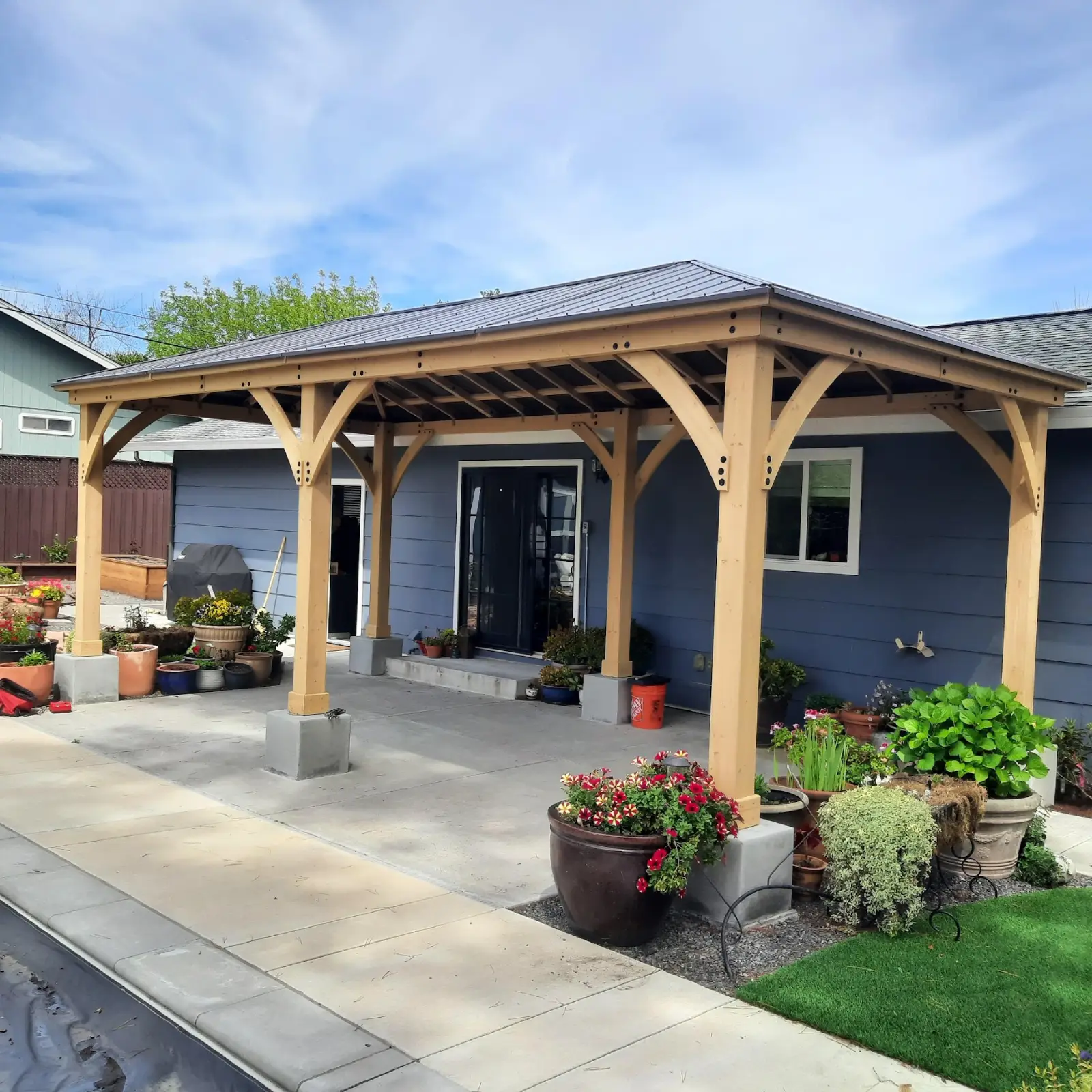 covered patio and concrete outdoor area